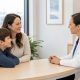 Parent and child speaking with a pediatric care professional in a bright Edmonton clinic