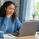 Quebec resident using a laptop to navigate family doctor registration and care options