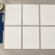 Blank numbered dossier exhibits arranged beside a blue folder on an orderly desk